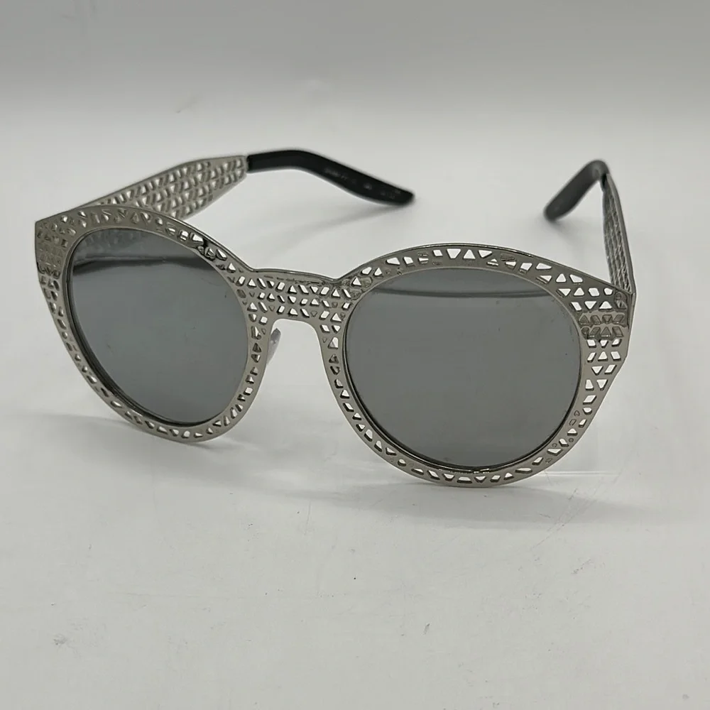 Silver laser cut steampunk sunglasses with gray lenses